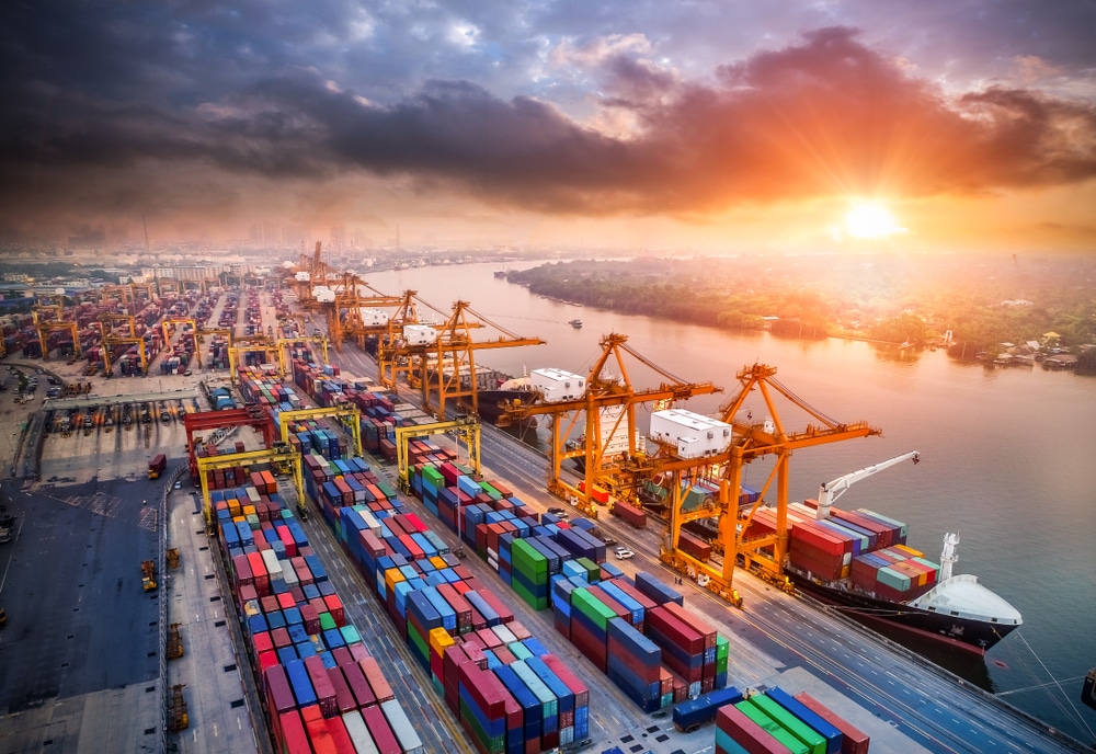 An image of a sunset with a port landscape