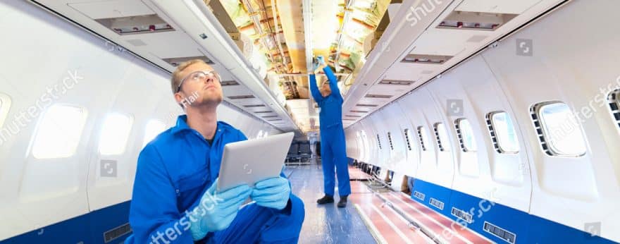 Two aerospace engineers working inside an aeroplane